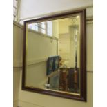 A reproduction bevel glass wall mirror