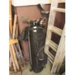 A black canvas golf bag with a selection of golf clubs