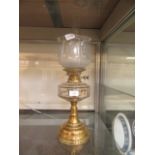 A Victorian brass and glass oil lamp
