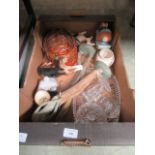 A tray containing glassware, ceramic dog, statues,