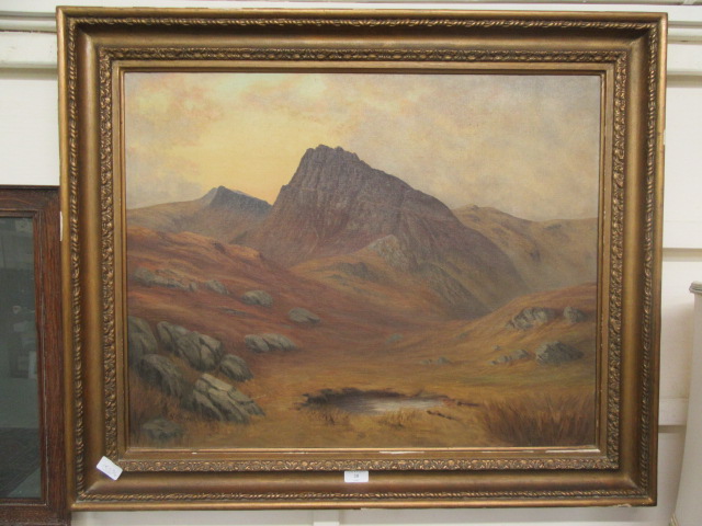 A framed oil on canvas of mountain scene signed G.