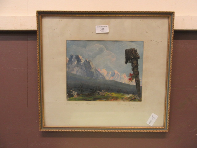 A framed and glazed oil of a mountain scene signed