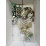 A box of costume jewellery including beads