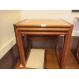 A nest of three mid 20th century design teak tables