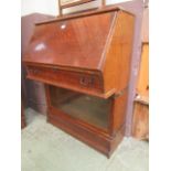 An early 20th century Globe Werlicke bureau bookcase having a fall to top door with glazed section