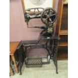 An early 20th century Singer manual leather sewing machine model no.