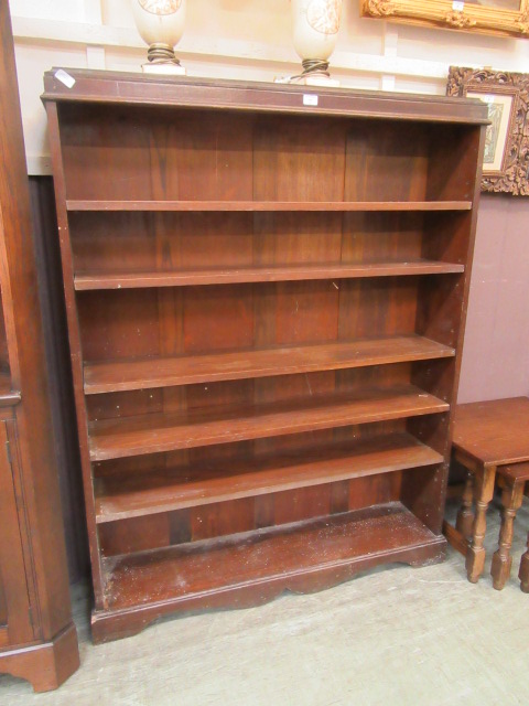 An early 20th century oak open bookcase with adjustable shelving