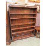 An early 20th century oak open bookcase with adjustable shelving