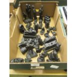 A tray containing carved coal in the form of trains, figures etc.