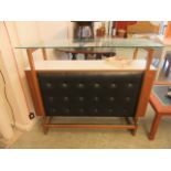A mid-20th century teak Formica and leather upholstered bar built by Bargetbuilt of London