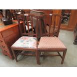 A pair of early 20th-century fruitwood framed dining chairs