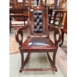 A child's eastern hardwood rocking chair having a brass inlay design