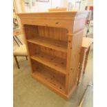 A modern pine open bookcase