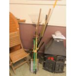A selection of long handled garden tools