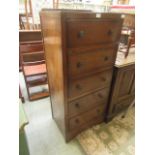 A mid-20th century oak veneered chest of five drawers