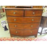 A 19th-century mahogany bow front chest of two short over three long drawers