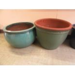 Two green glazed terra cotta pots