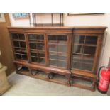 An early 20th-century oak break front glazed bookcase