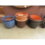 A selection of glazed and unglazed garden plant pots