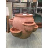 A terracotta strawberry pot