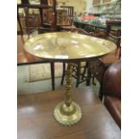 A late 19th century brass wine table