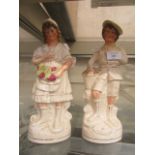 A pair of Staffordshire figures of girl and boy