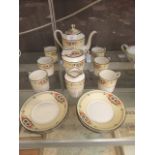 A French Limoges part tea set comprising of six cups and saucers, sugar bowl,