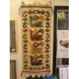 A South American embroidered wall hanging