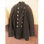 A navy blue Warwickshire County fire brigade jacket