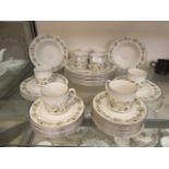 A Royal Doulton part dinner set 'Vanity Fair' comprising of cups, saucers, side plates,