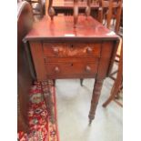 A Victorian mahogany work table having drop leaves and two drawers