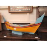 A hand made boat on stand