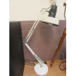 A white angle poise style lamp