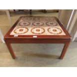 A mid-20th century tiled top coffee table