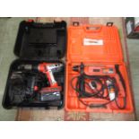 A boxed cordless drill together with a boxed electric hammer drill