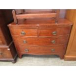 An early 19th-century mahogany bow front chest of two short over three long drawers