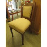 An Edwardian oak framed single chair