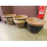 Three earthen ware garden pots