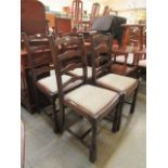 A set of four ladder back dining chairs