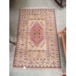 A modern pink and brown ground rug
