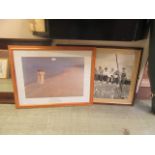 Two framed and glazed prints of skyscrapers and ladies on beach