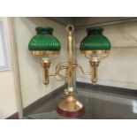 A modern brass effect twin lamp desk light