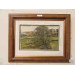A framed oil painting of sheep in field signed bottom left