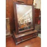 A 19th century mahogany toilet mirror with single drawer to base