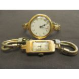 An 18 carat gold cased lady's watch along with a yellow metal lady's watch