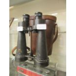 A pair of military binoculars in case