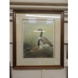 A framed and glazed limited edition print of Canadian geese signed Michael Oxenham