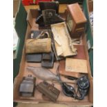 A tray containing second world war related items along with photo frames and a mantle clock