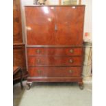 An early 20th century Anne Boyner cabinet on three drawer chest