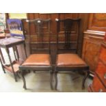 A pair of early 20th century dining chairs